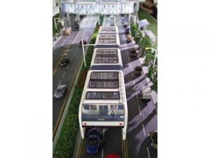 The electric Bus Rapid Transit (BRT) system as featured in Forum For The Future's report. The lower level of the bus is open, straddling the road to act like a tunnel that cars can drive through